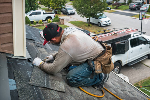 Professional Roofing technician working in Russell, IL